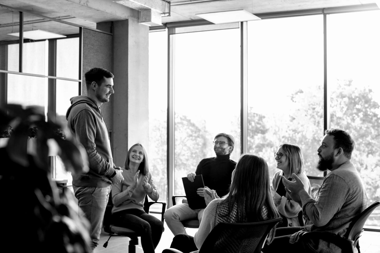 Professional training session with participants reviewing fraud detection documentation